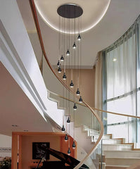  Sleek modern LED pendant lights hanging in a contemporary stair case setting . Golden Atelier 2