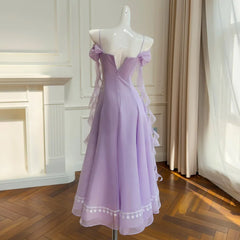 Back view of an off-shoulder gauze A-line midi dress with lace trim and chiffon sleeves.