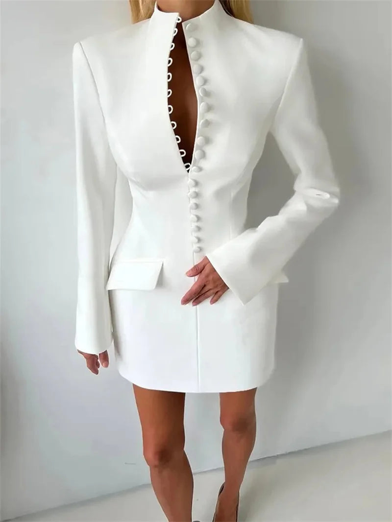 White blazer and skirt set on a plain background