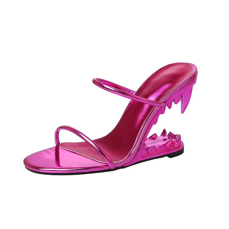 Pink high-heeled sandal with clear strap on a white background