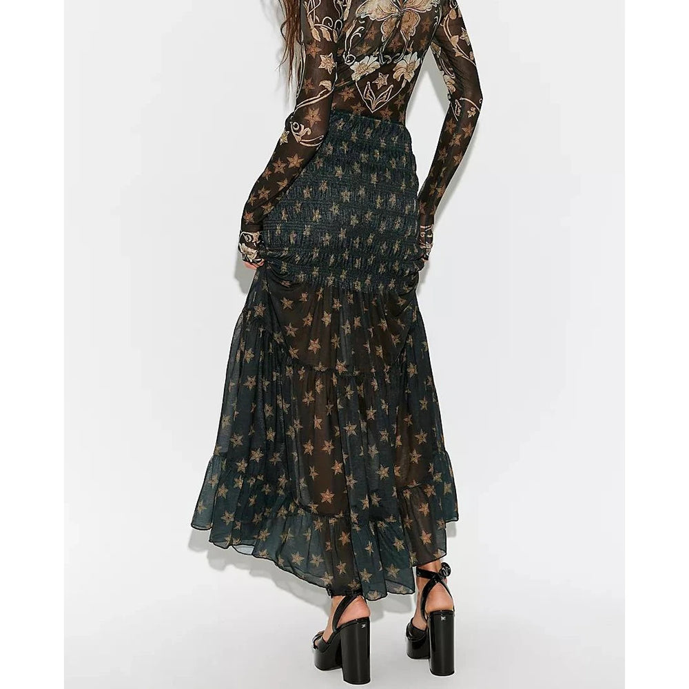 Back view of smocked ruffled tiered star print sheer maxi skirt