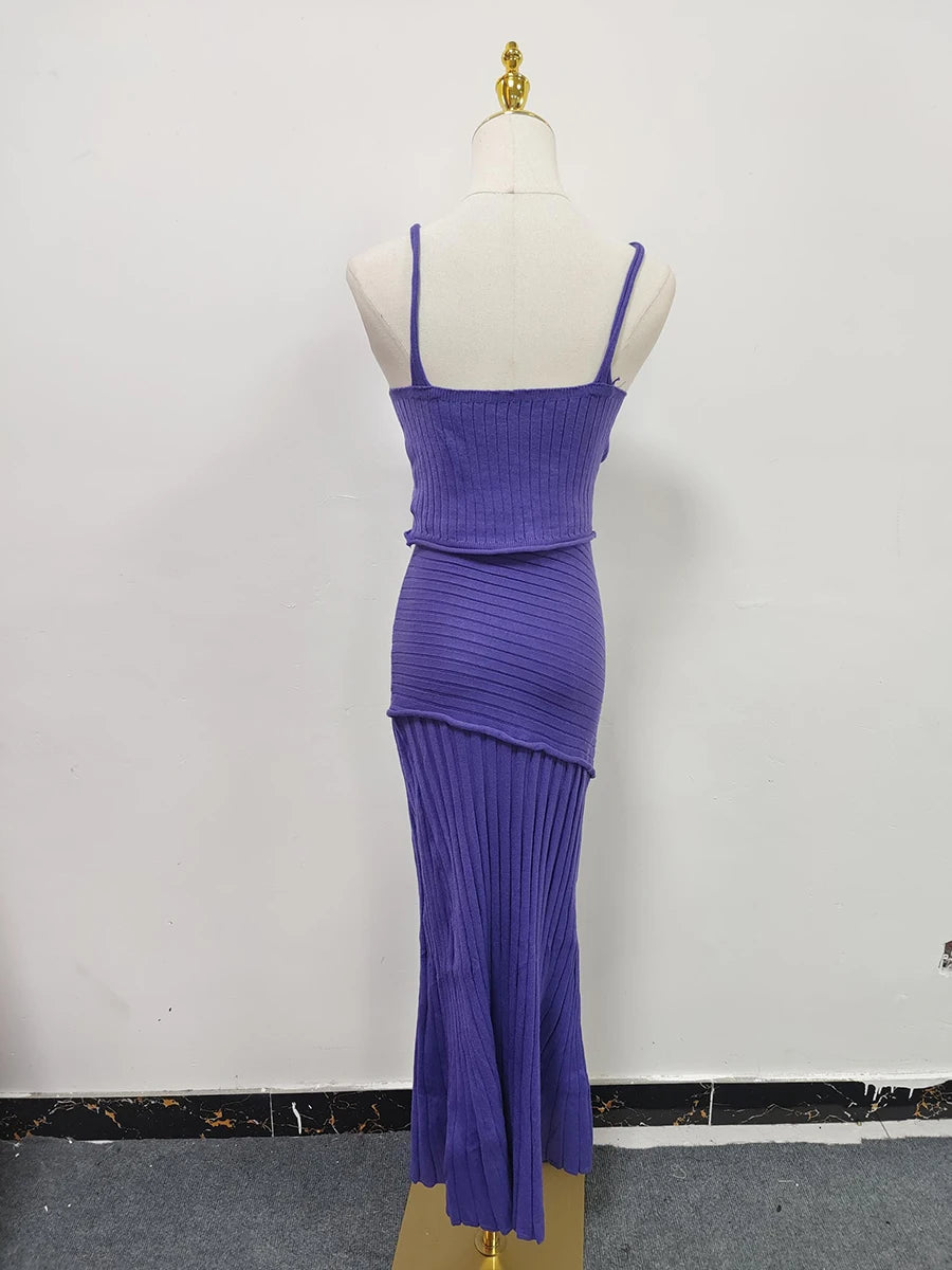Purple dress on a mannequin against a white background