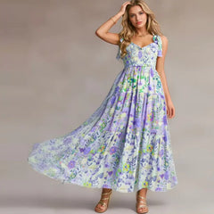 A flowing floral smocked bust tie strap maxi dress in motion.