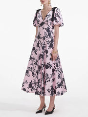Woman wearing a pink floral dress on a white background