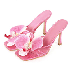 Pink square-toe flower mules for women with 10cm thin heels.