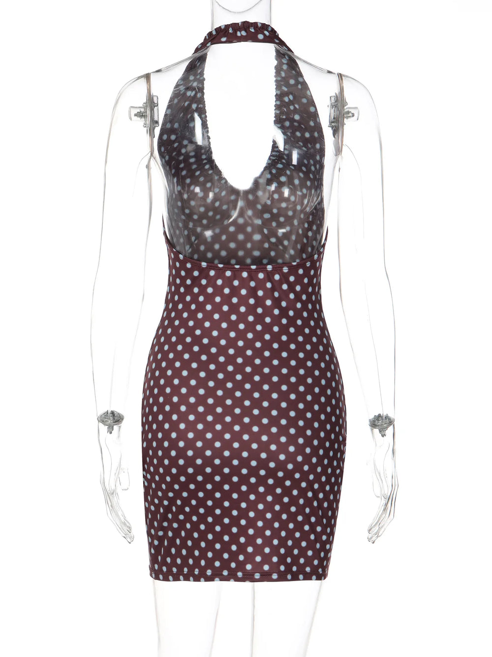 Polka dot dress on a transparent mannequin against a white background