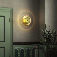 The Golden Atelier Modern Wall Sconce illuminating a hallway, creating a warm and inviting atmosphere. D