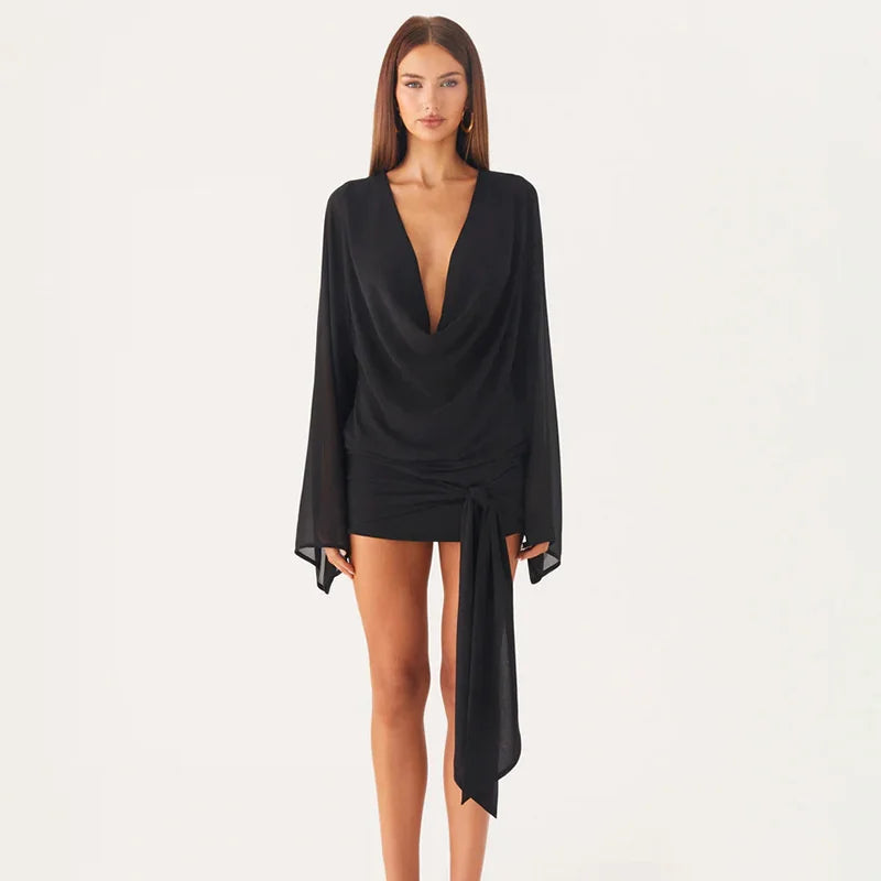 Black dress with a plunging neckline and long sleeves