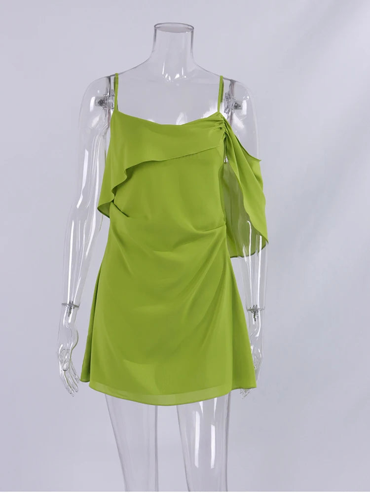 Green dress on a mannequin against a white background