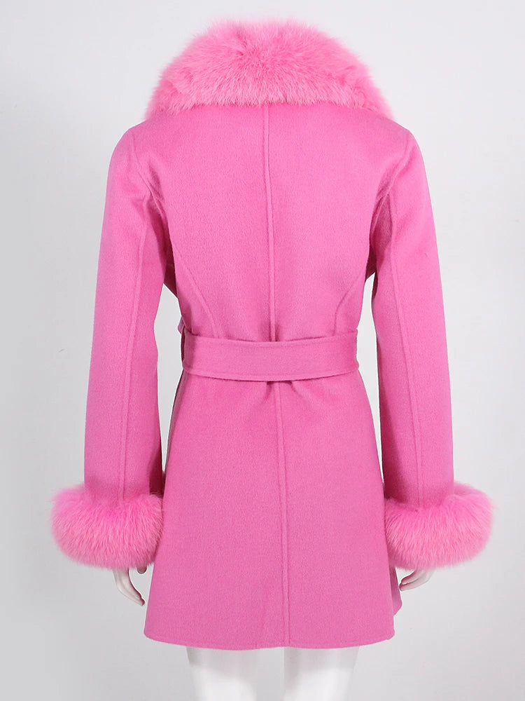 Pink coat with fur trim on a white background