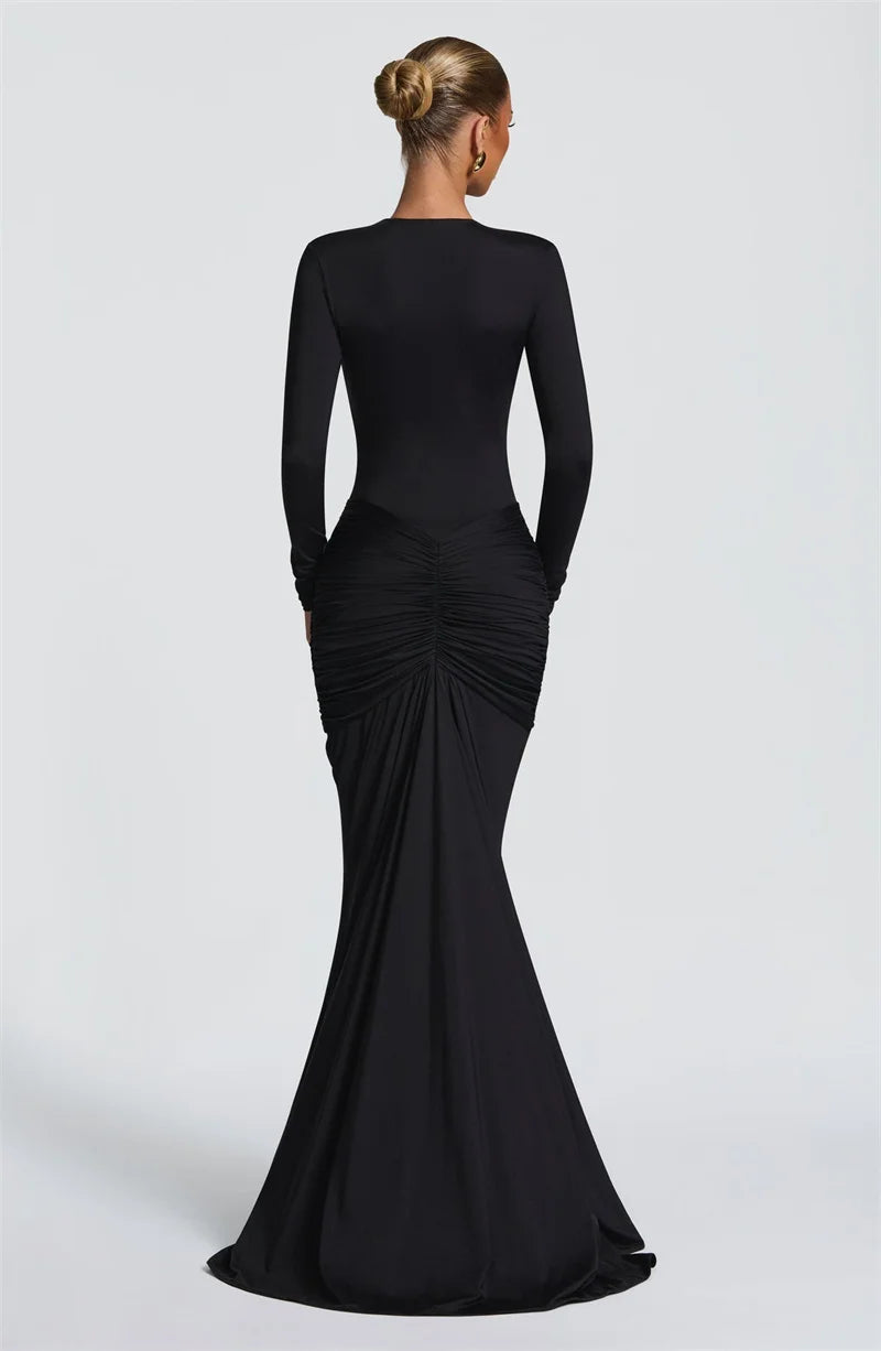 Black evening gown with long sleeves on a white background