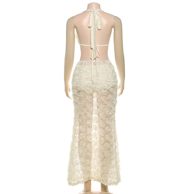 Mannequin wearing a cream lace dress with a halter neck design on a white background