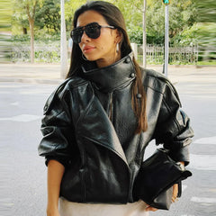 Close-up of the faux leather mock neck jacket's asymmetrical zipper.