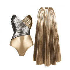 Metallic one-shoulder ruffled bodysuit with black briefs and a gold pleated maxi skirt