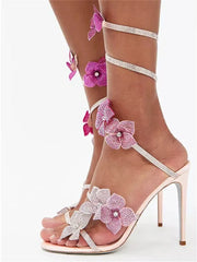 Crystal flower ankle strap stiletto heels on a white background