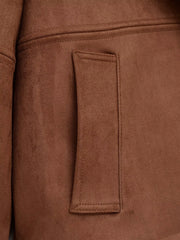 Detail of pocket on faux suede jacket