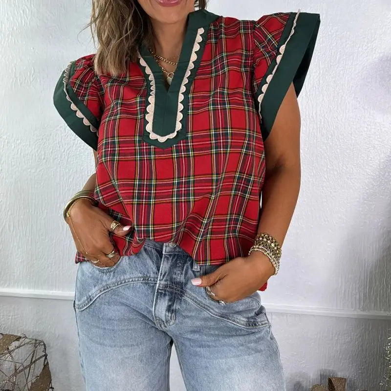 Model wearing plaid V-neck ruffle sleeve top