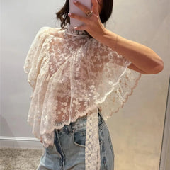 White floral lace mock neck top detail with ruffled asymmetrical hem