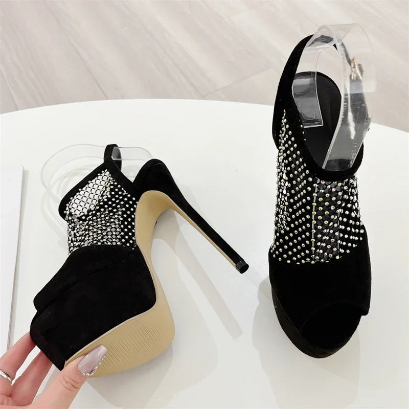 Black high-heeled shoes with studded details on a white surface