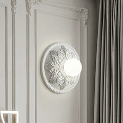 Close-up of a Parisian wall sconce highlighting its sleek metal frame and translucent milk white glass. C