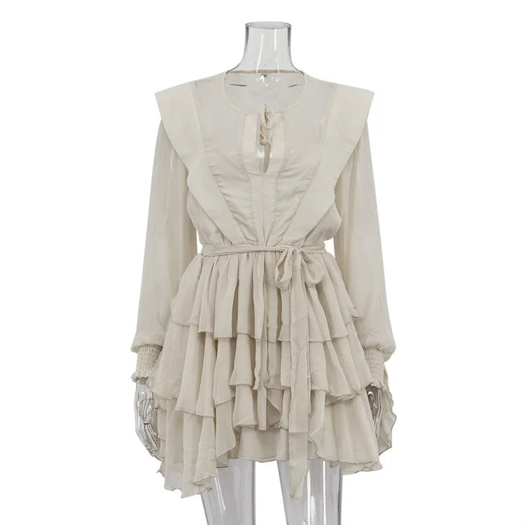 Beige dress on a mannequin against a white background