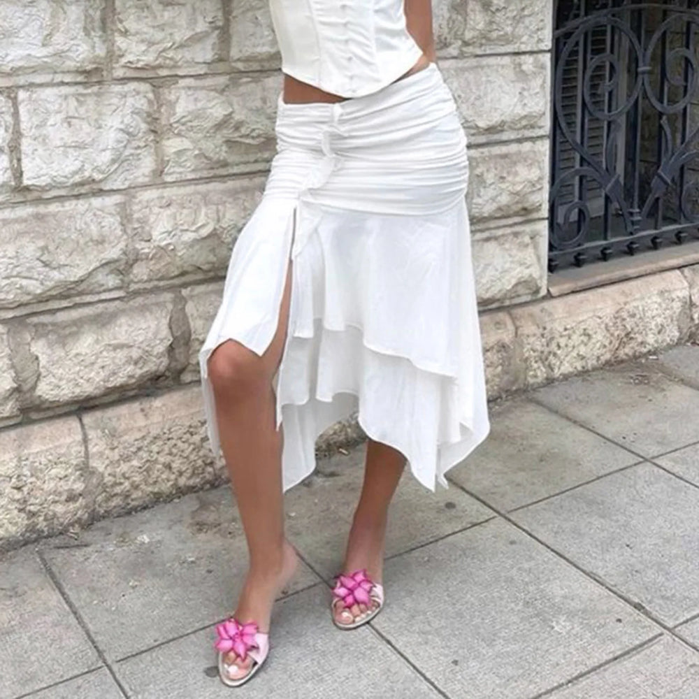 Detail shot of an asymmetrical ruched slit midi skirt showing fabric texture.