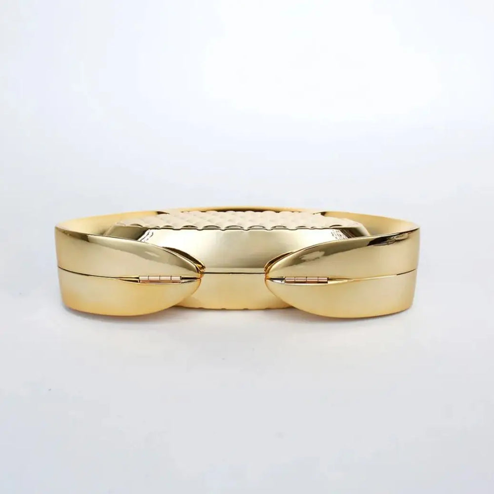 Gold ring with a textured band on a light gray background