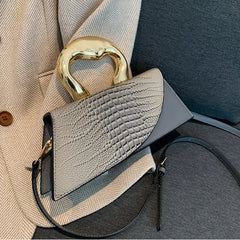 Gray alligator textured top handle bag with golden handle