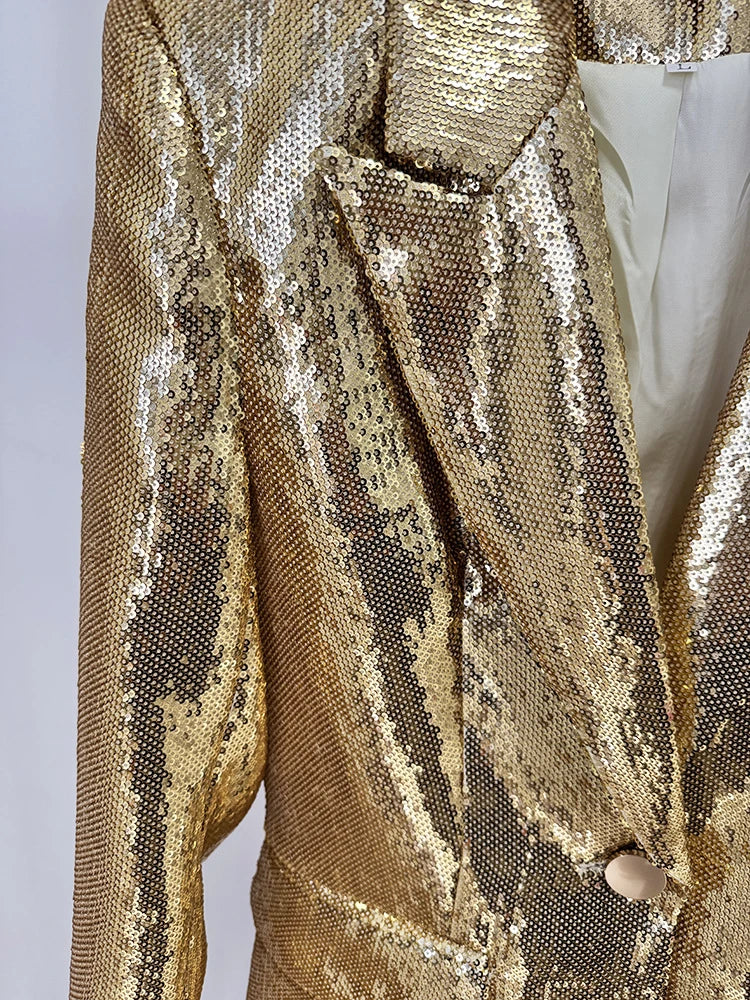 Gold sequin jacket on a plain background