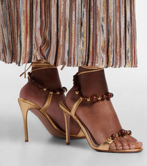 Golden beaded ankle strap stiletto sandals