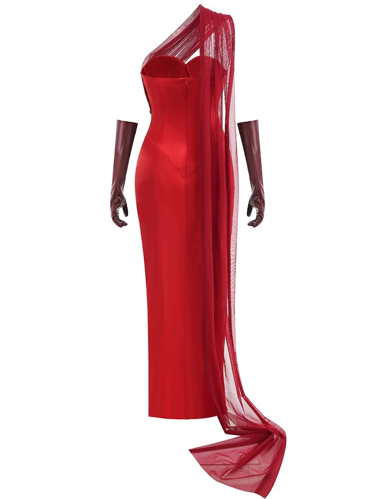 Red evening gown with sheer overlay on a white background