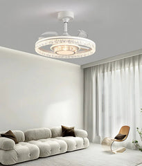 Modern living room with a chandelier, sofa, and chair.