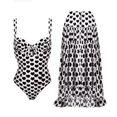 Black heart print one-piece swimsuit with a matching high-low ruffled skirt.