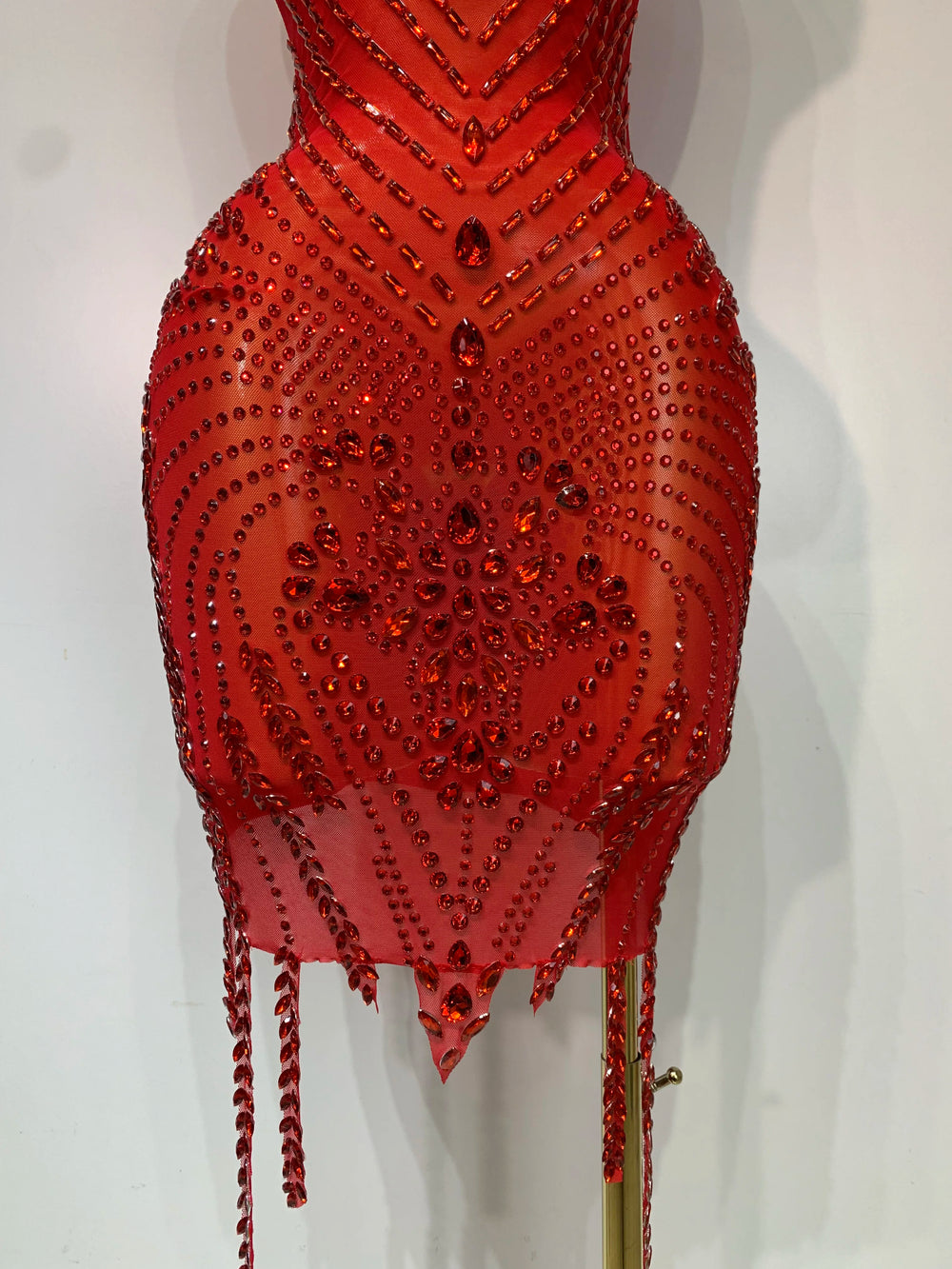 Red beaded dress on a white background