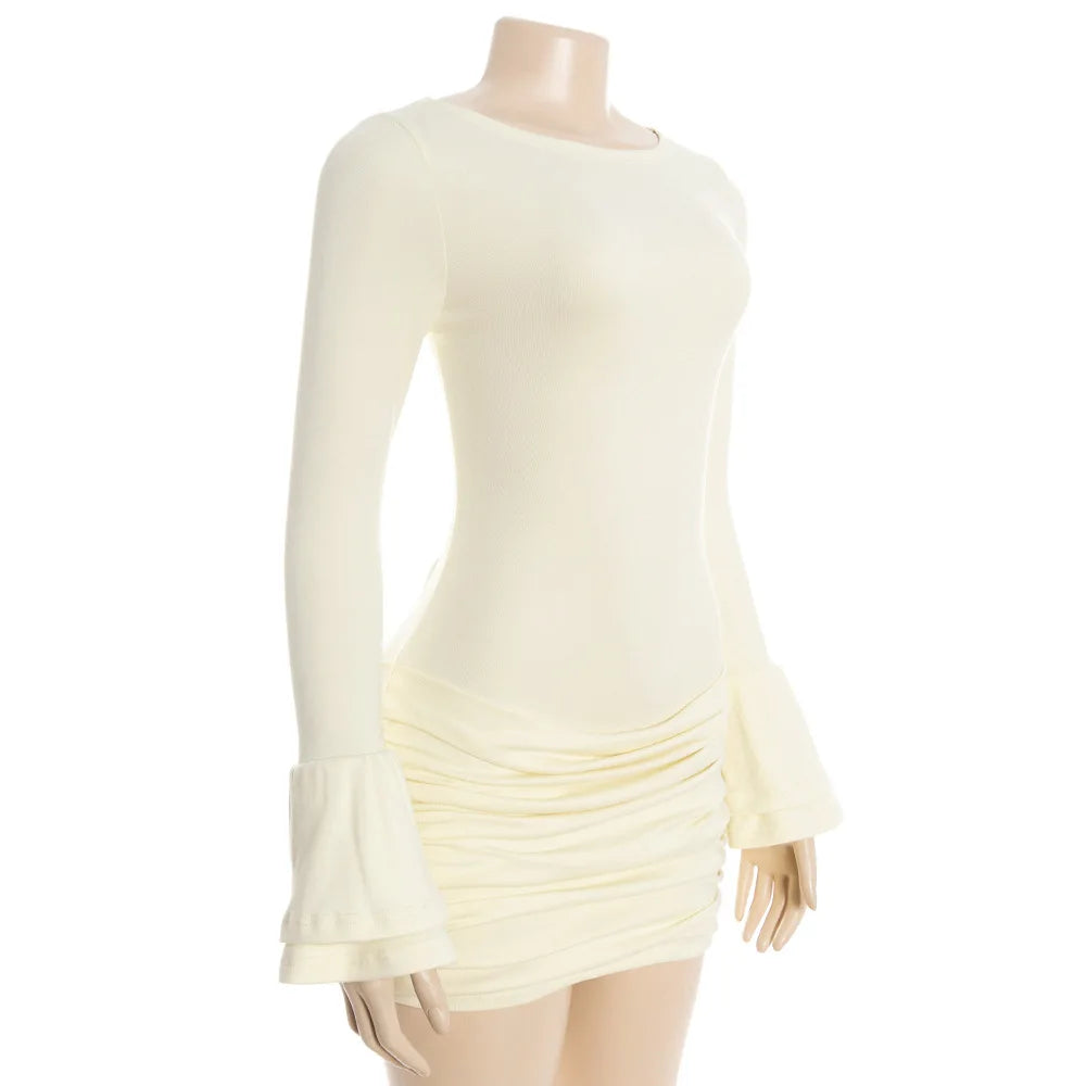 Mannequin wearing a light yellow dress with ruffled details on a white background
