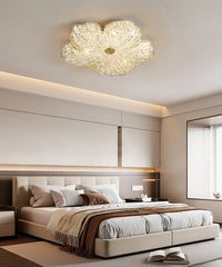 Modern bedroom with a decorative ceiling light fixture.
