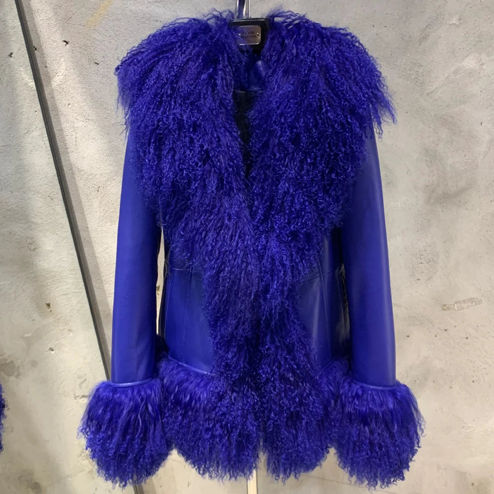 Blue furry coat on a mannequin against a concrete wall.