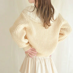 Woman wearing a Peter Pan Collar Spliced Knitted Sweater 