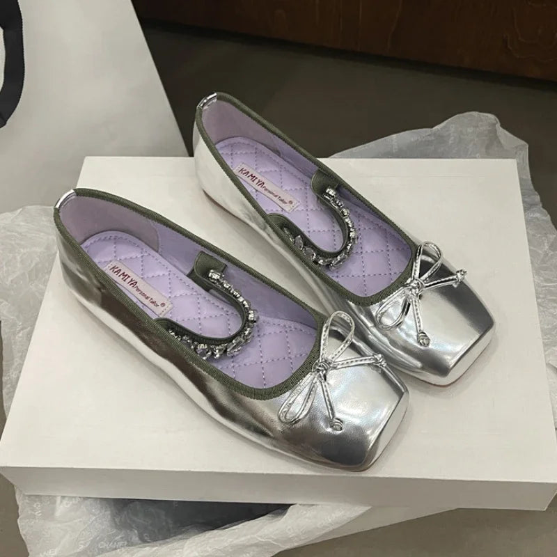 Silver square toe ballet flats with a bow and crystal embellishment