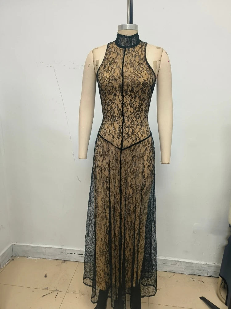 Lace dress on a mannequin against a plain background