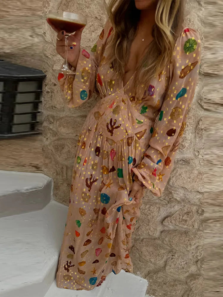 Full view of a person wearing the printed shell motif maxi dress.