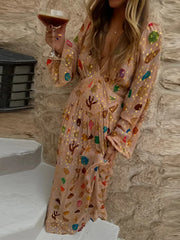 Full view of a person wearing the printed shell motif maxi dress.