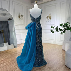 Mannequin  displaying  the beaded mermaid evening gown with overskirt, showcasing its flattering silhouette and graceful movement. Golden Atelier 3