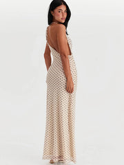 Polka dot maxi dress with backless design and spaghetti straps for evening parties