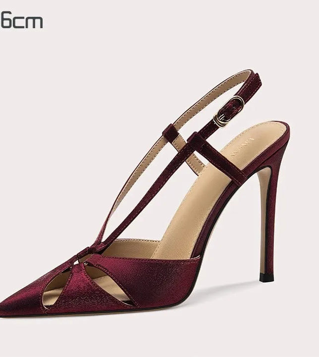 Maroon high-heeled sandal on a light gray background