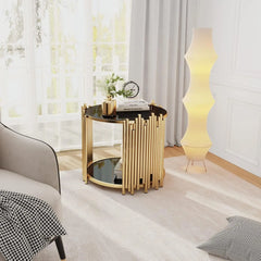 Modern gold side table with black glass top in a stylish room.