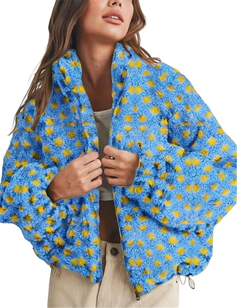 Person wearing a blue jacket with yellow floral patterns on a white background