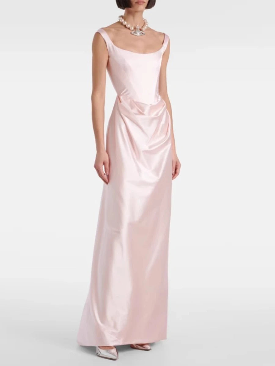 Woman wearing a pink satin gown on a white background