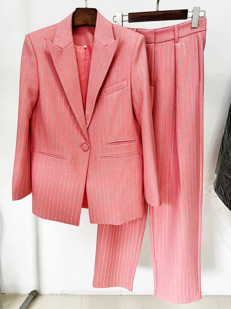 Pink pinstripe suit on a hanger against a white background