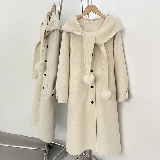 Hooded wool blend coat in beige with a detachable pom-pom scarf.